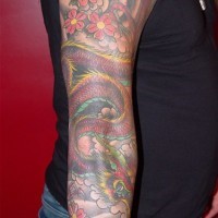 Japanese demon and flowers full sleeve tattoo