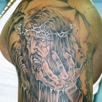 Jesus pain black ink tattoo on shoulder