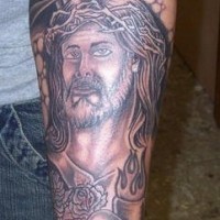 Cross and sacred heart sleeve tattoo