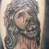 Jesus in crown of thornes with blood black ink tattoo