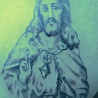 Tatuaje negro de Jesús bendiciendo