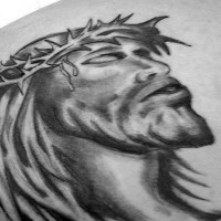 Jesus in crown of thornes black ink tattoo