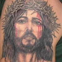 Jesus in crown of thornes tattoo