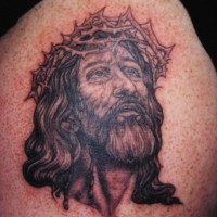 Jesus in crown of thornes black tattoo