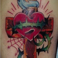 Heart on cross with web tattoo