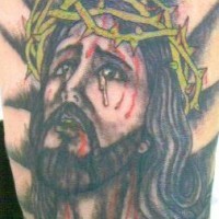 Tatuaje retrato de Jesús sangrando
