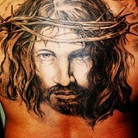 Jesus head in crown of thornes tattoo