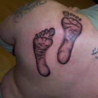 Kid footprints tattoo
