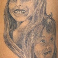 Baby portraits black ink tattoo