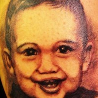Smiling kid tattoo