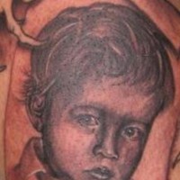 Little kid black ink tattoo