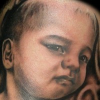 Little kid tattoo made from photo