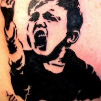 Agressive kid black ink tattoo