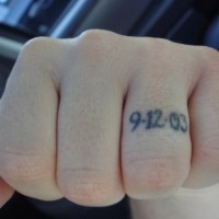 Knuckle tattoo, little size date on one finger