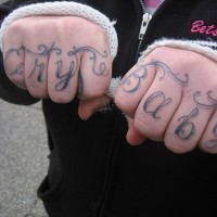 Knuckle tattoo, cry baby, curled styled  inscription