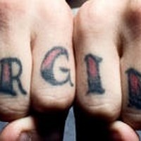 Knuckle tattoo, forgiven, dark styled inscription