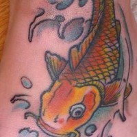 Golden koi fish tattoo on foot