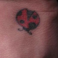 Minimalistic ladybug tattoo