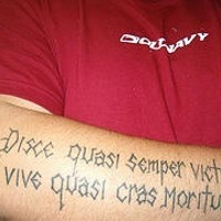 Middle age style latin writings tattoo