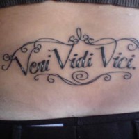 Veni vidi vici tattoo on lower back