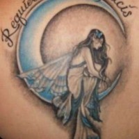 Sad angel on moon crescent tattoo