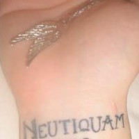 Neutiquam erro wrist tattoo