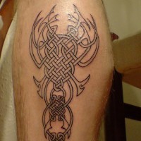Leg tattoo, black and white braided pattern