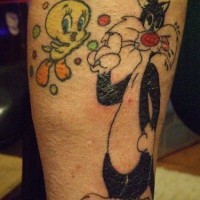 Leg tattoo, black cartoon's cat and chicken