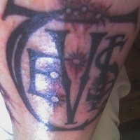 Leg tattoo, dreadful black sign with letters