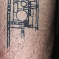 Leg tattoo, black square designed image with circles and curls