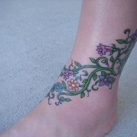 Leg tattoo, beautiful colourful plant with flowers