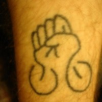 Leg tattoo, designed black and white fist
