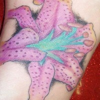 Realistic dotted pink lily tattoo