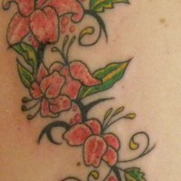 Tribal tracery with lilies tattoo