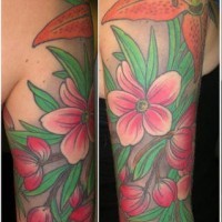 Lily flowers and blossom coloured tattoo