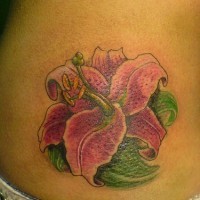 Alpine lily flower tattoo on hip
