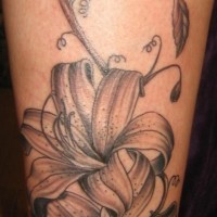 Lily flowers black ink tattoo