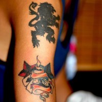Black heraldic lion tattoo