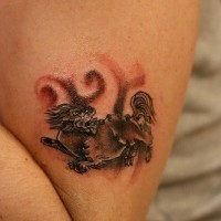 Asian style small lion tattoo