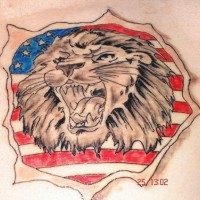 Roaring lion on usa flag tattoo