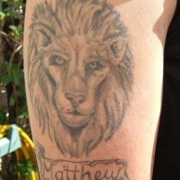 Lion head memorial tattoo