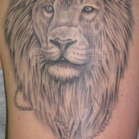 Crowned lion with key tattoo