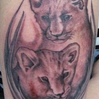 Two lion cubs tattoo