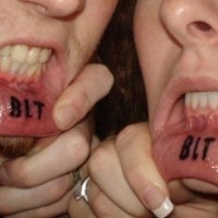 Lip tattoo, blt, three big letters