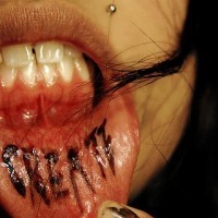 Lip tattoo, bloody, pounded inscription