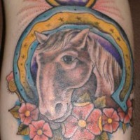 Horse portrait in horseshoe tattoo in colour