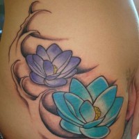 Blue and purple lotus in waves tattoo