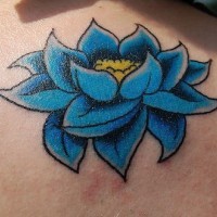 Blue and yellow lotus flower tattoo