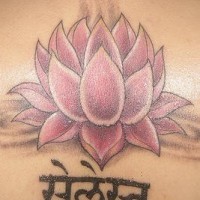 Pink lotus with hindu writings tattoo