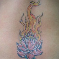 Lotus on fire tattoo on lower back